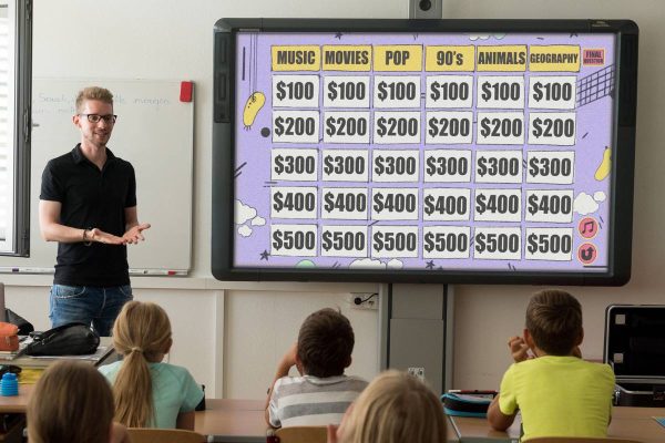 students playing the classroom Jeopardy on smartboard
