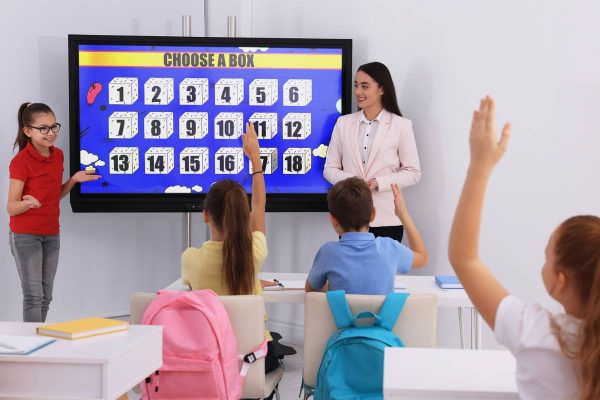 mystery box game on interactive whiteboard in classroom