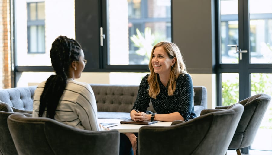 Three counseling psychology professionals engaged in collaborative discussion in modern office setting